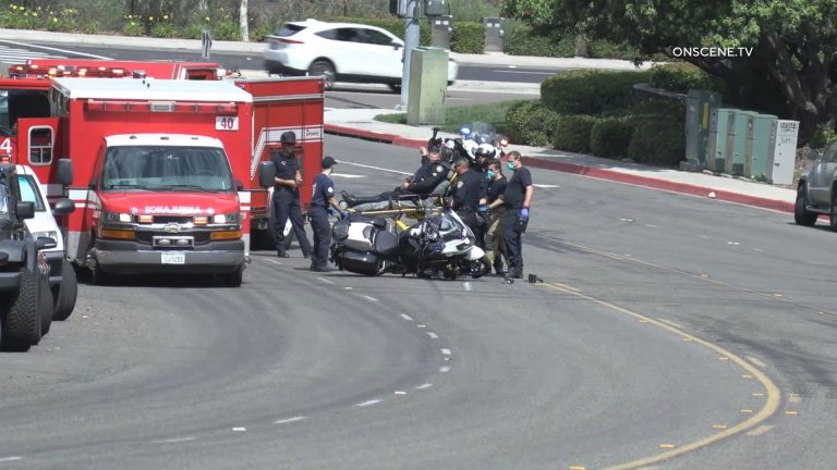 The injured officers is treated outside an ambulance. Courtesy OnScene.TV